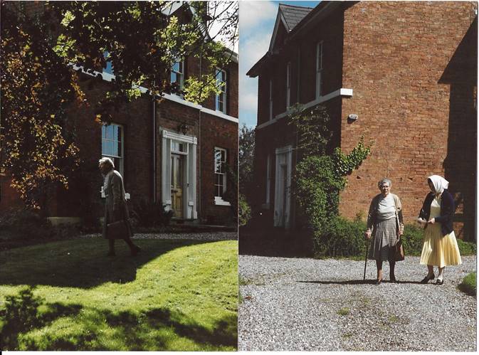 A couple of people walking in front of a brick building

Description automatically generated