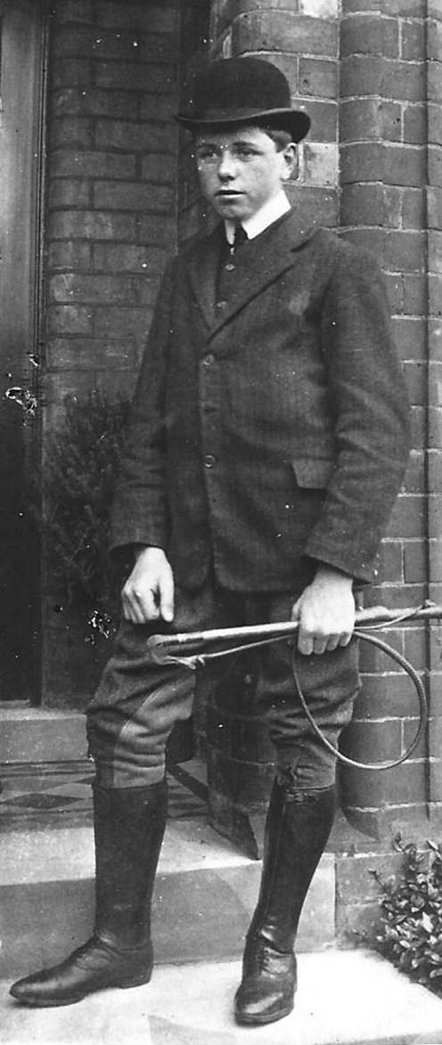 A vintage photo of a person in a suit and tie

Description automatically generated