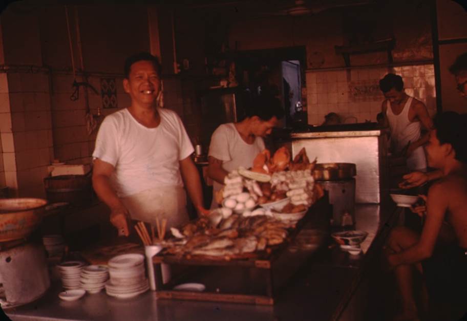 A group of people cooking in a kitchen

Description automatically generated with medium confidence