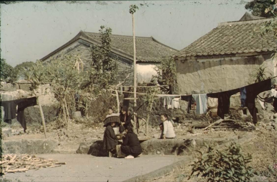 A group of people outside a house

Description automatically generated with low confidence