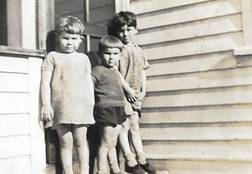 A group of children standing outside a building

Description automatically generated with low confidence