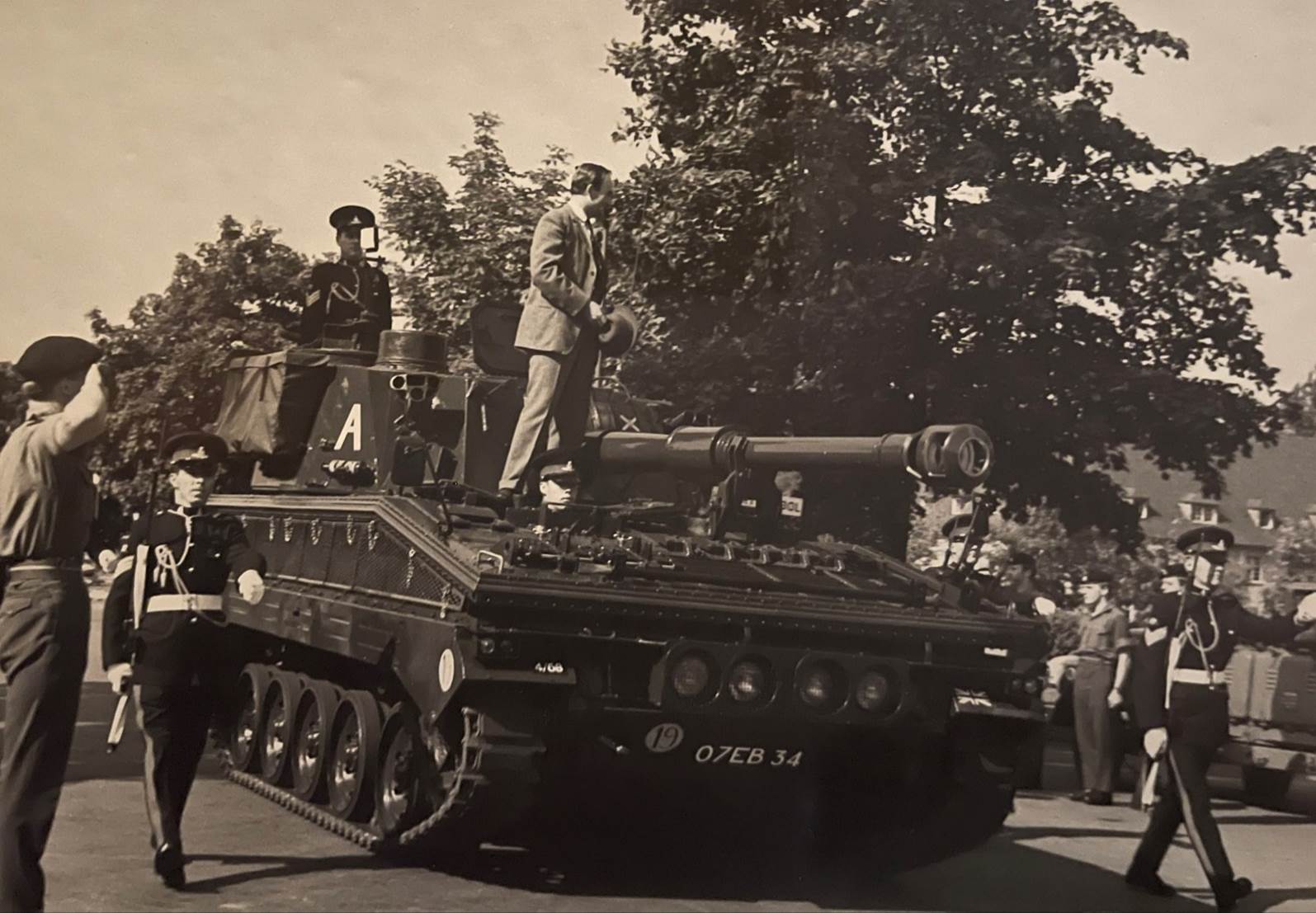 A group of men on a tank

Description automatically generated with low confidence