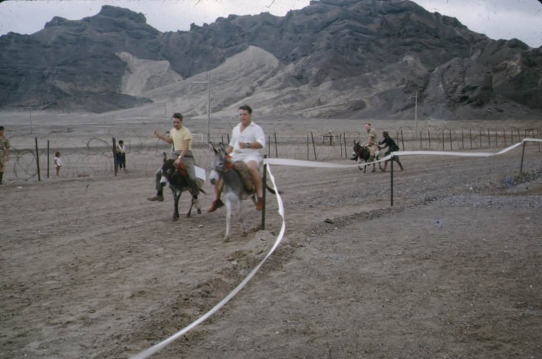 People riding horses on a dirt road

Description automatically generated with medium confidence