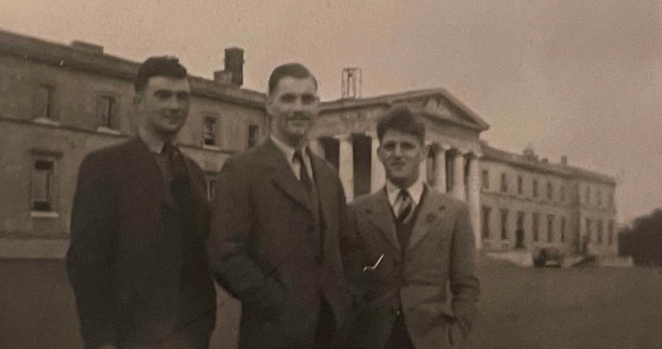 A group of men standing in front of a building

AI-generated content may be incorrect.