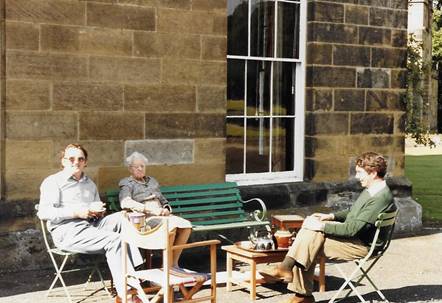 A group of people sitting outside

Description automatically generated