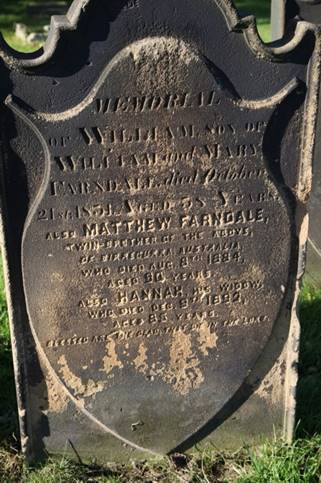 A tombstone with text on it

Description automatically generated