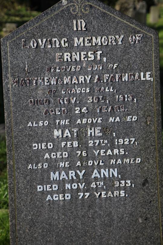 A close-up of a tombstone

Description automatically generated