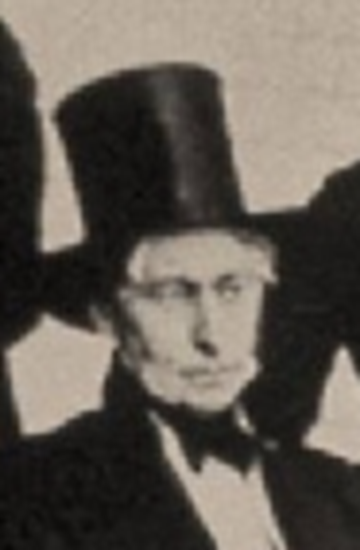 A person wearing a top hat

Description automatically generated