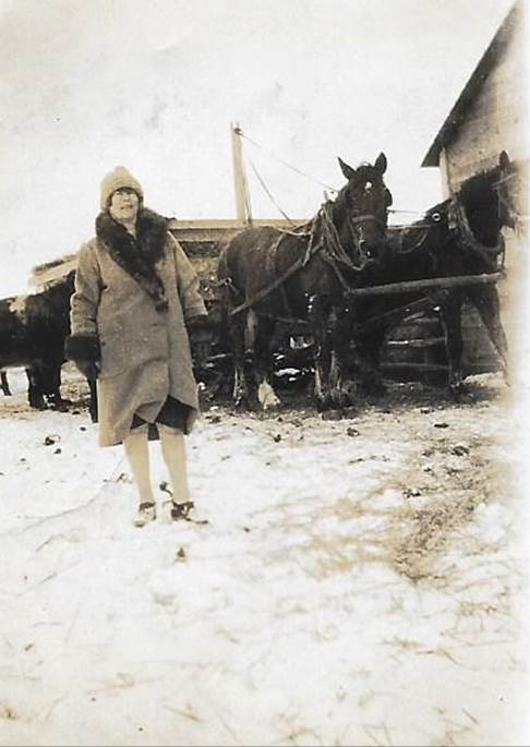 A close-up of a person walking in the snow

Description automatically generated