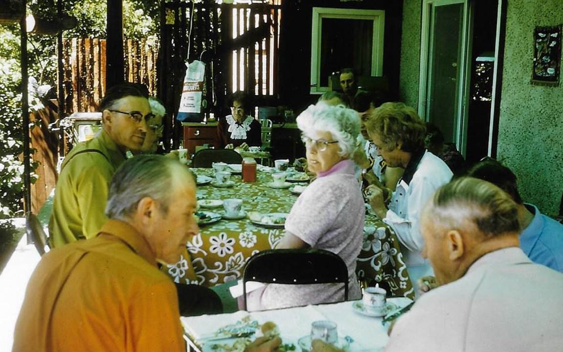 A group of people sitting at a table

Description automatically generated