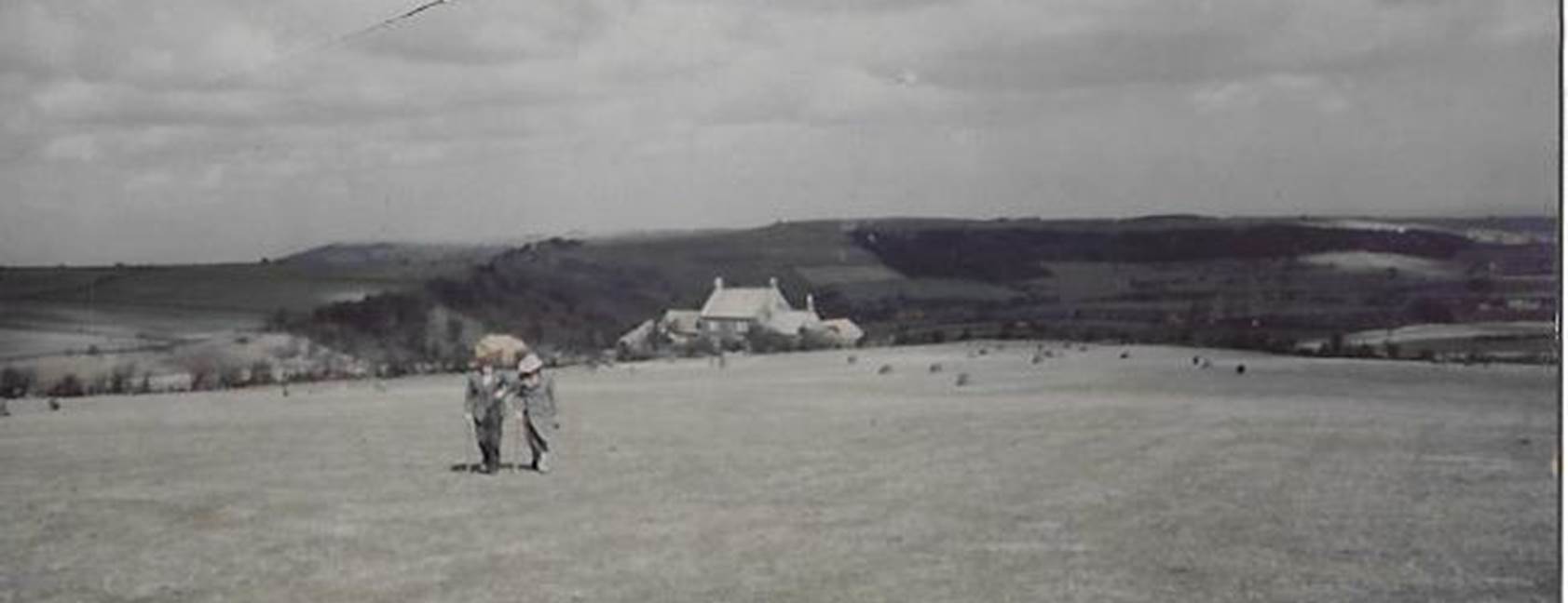 A group of people standing on top of a sandy beach

Description automatically generated