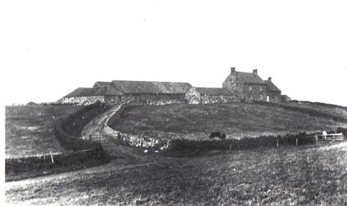 A black and white photo of a house on a hill

Description automatically generated with medium confidence