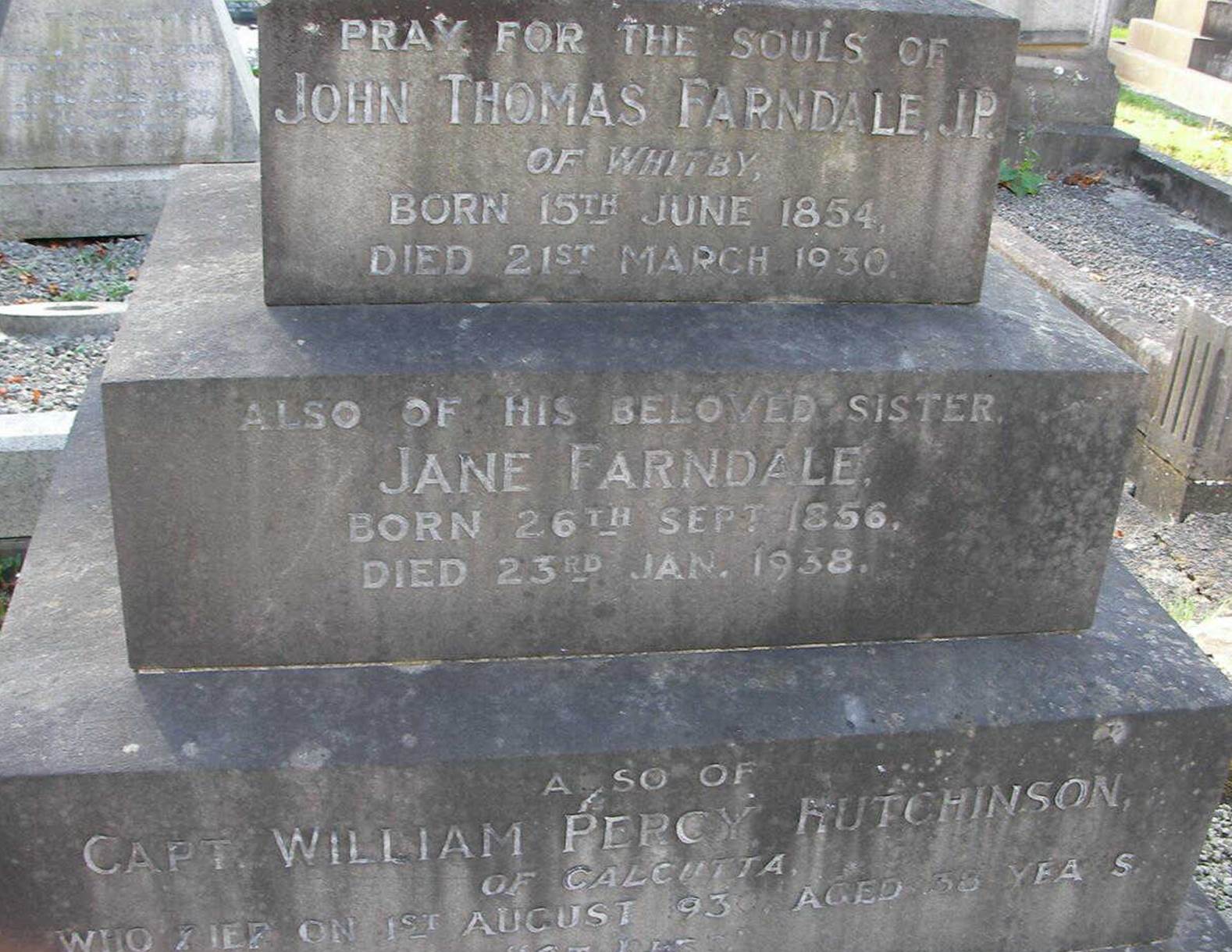 A close-up of a grave stone

Description automatically generated