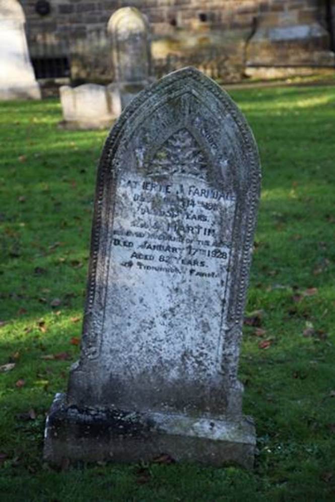 A close-up of a tombstone

Description automatically generated