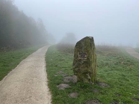 A stone on a path

Description automatically generated