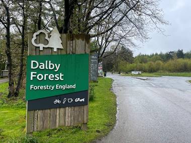 A sign on a wooden board

Description automatically generated