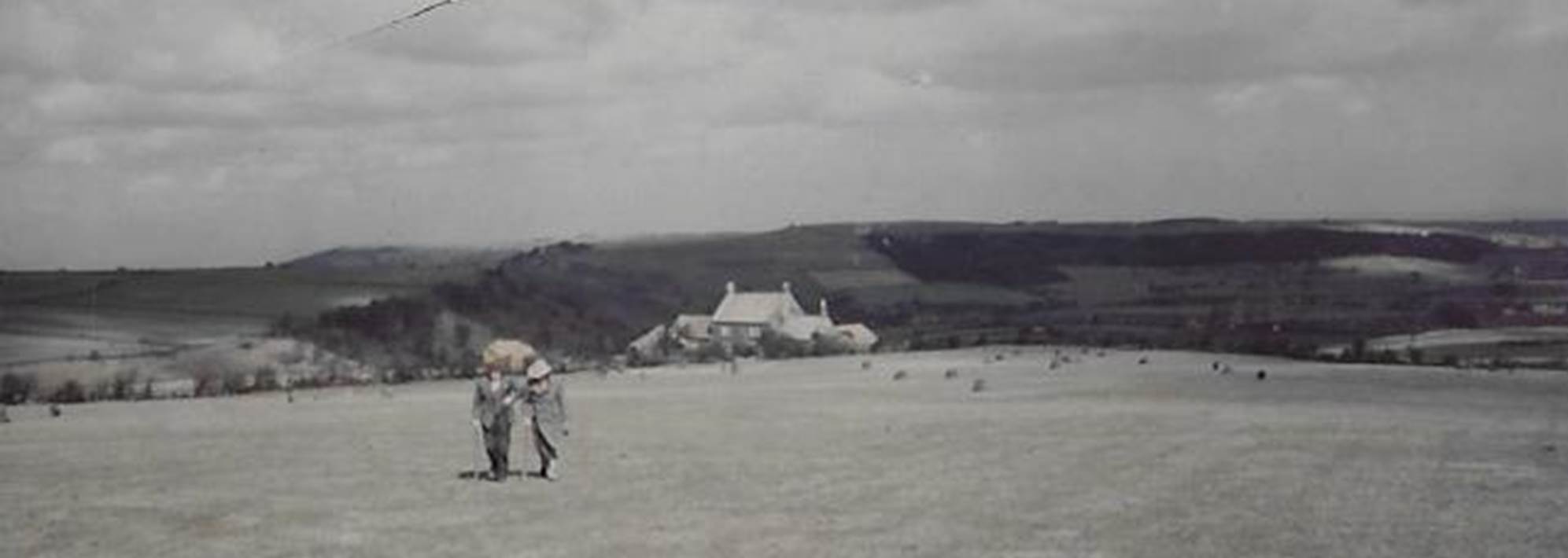 A group of people standing on top of a sandy beach

Description automatically generated