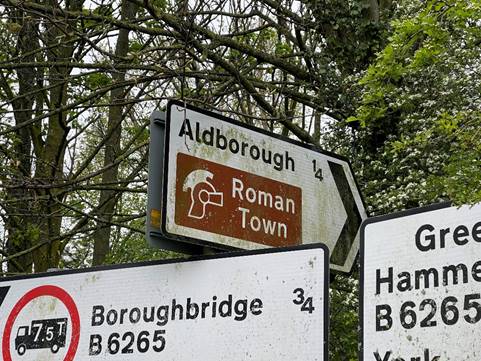 A group of street signs

Description automatically generated