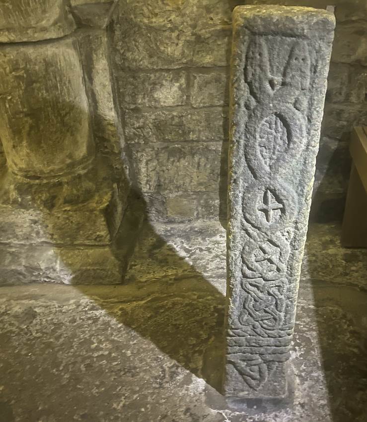 A stone pillar with carved text

Description automatically generated with medium confidence