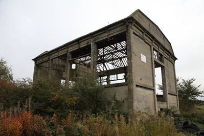 A building with a broken roof

Description automatically generated with medium confidence