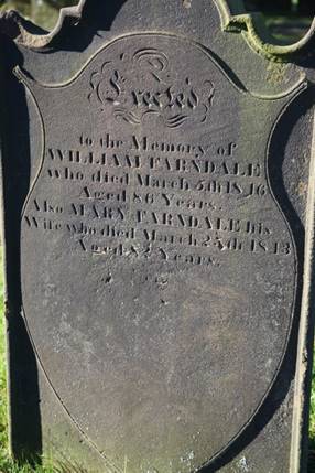 A close-up of a tombstone

Description automatically generated