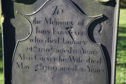 Close-up of a grave stone

Description automatically generated