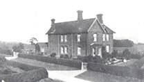 A black and white photo of a house and some trees

Description automatically generated with low confidence