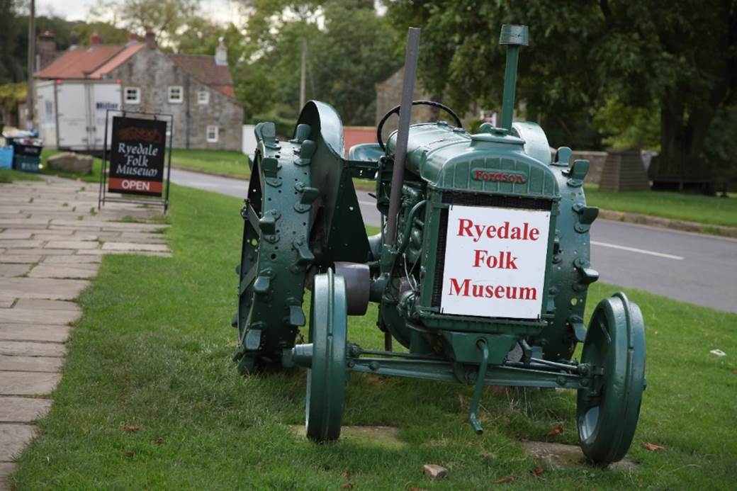 A tractor parked in a field

Description automatically generated