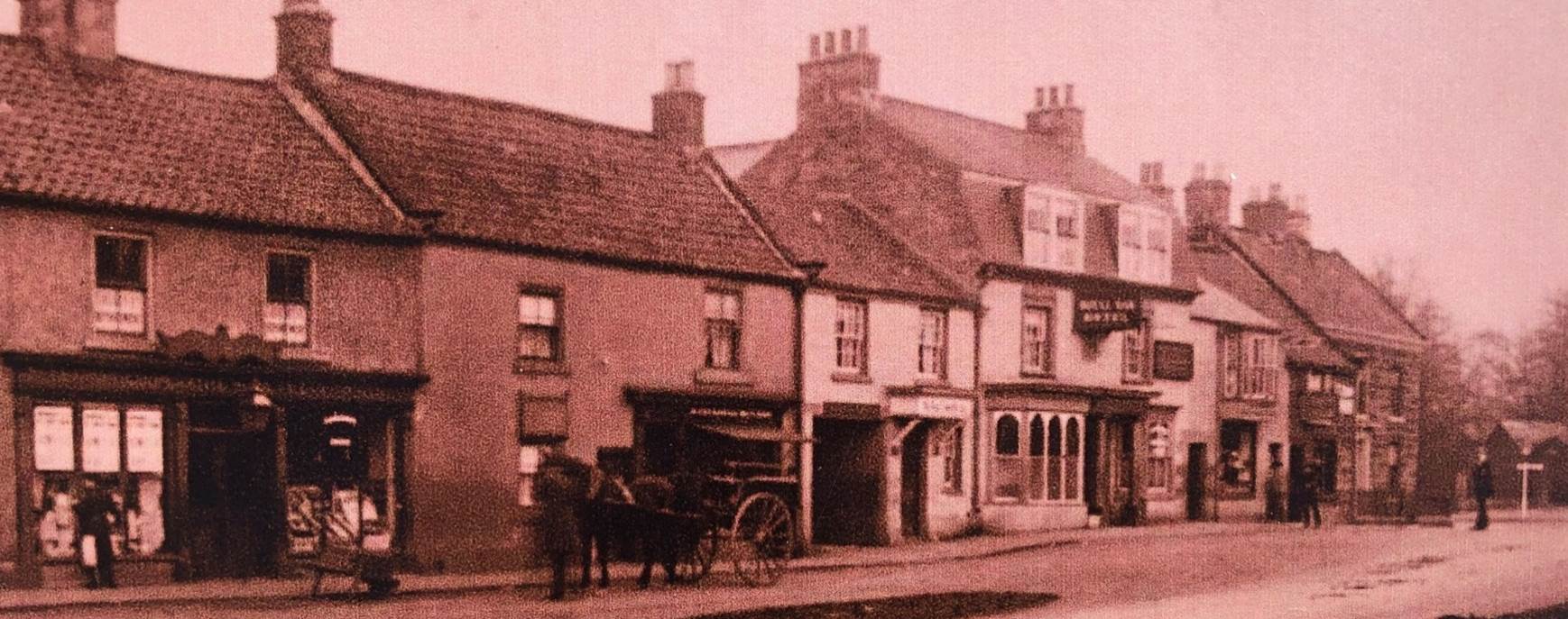 A vintage photo of an old building

Description automatically generated