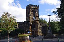 A stone building with a clock tower

Description automatically generated