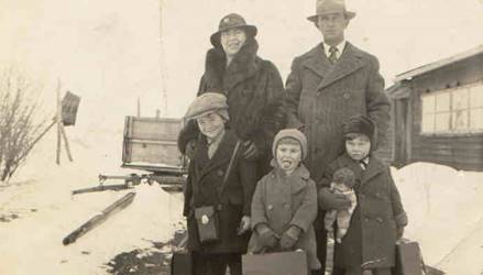 A group of people posing for a photo in the snow

Description automatically generated with medium confidence