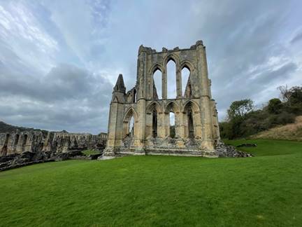 A stone building with arches and windows

Description automatically generated with medium confidence