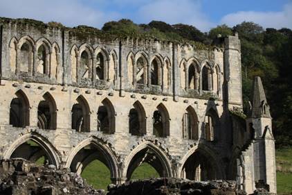 An old stone building with many arches

Description automatically generated