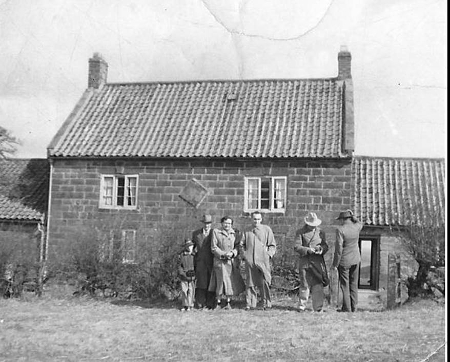 A vintage photo of a house

Description automatically generated