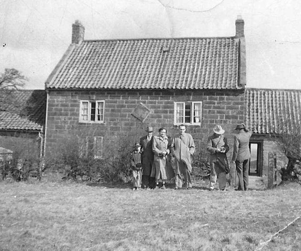 A vintage photo of a house

Description automatically generated